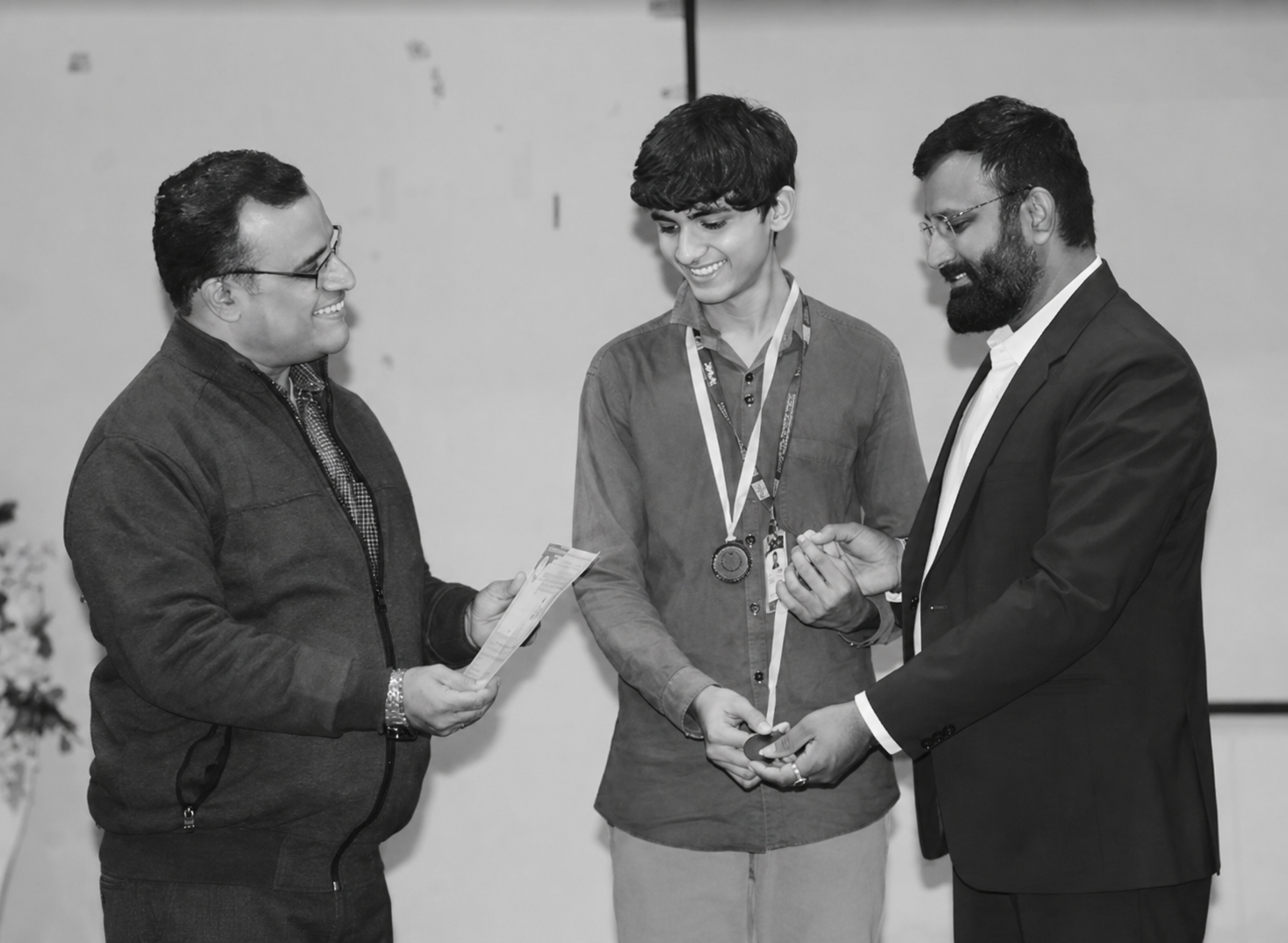 Tahir Pathan receiving an award at a college event